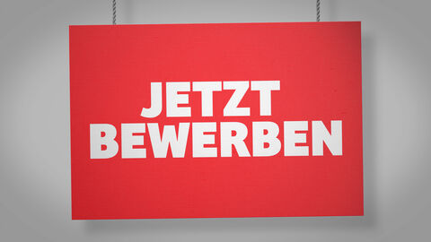 Schild mit Schriftzug: Jetzt bewerben Schild mit Schriftzug: Jetzt bewerben